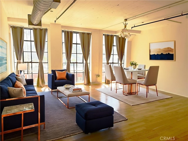 200 N San Fernando Rd Unit 313, Los Angeles, CA 90031 - living area with wood finished floors and a chandelier