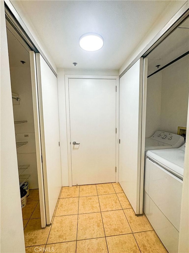 200 N San Fernando Rd Unit 313, Los Angeles, CA 90031 - laundry room featuring light tile patterned floors and separate washer and dryer