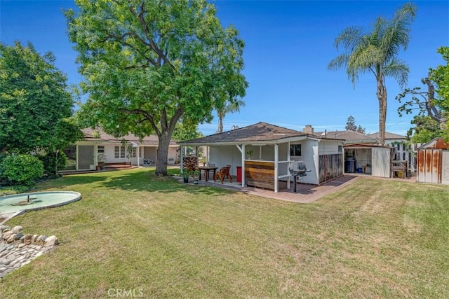 1011 Portola Dr, Arcadia, CA 91007 - view of grassy yard featuring a patio area and an outbuilding