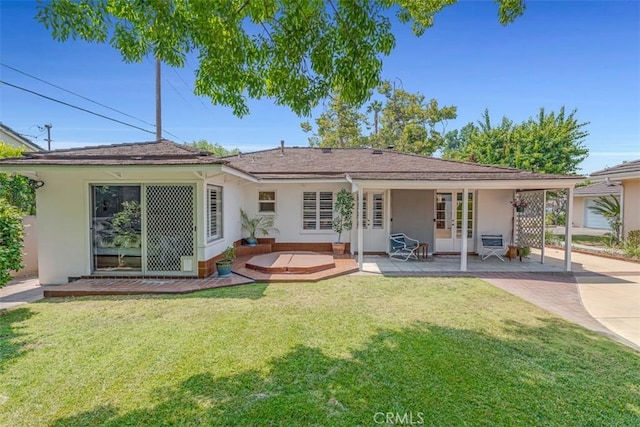 1011 Portola Dr, Arcadia, CA 91007 - rear view of house featuring french doors, stucco siding, a lawn, and concrete driveway
