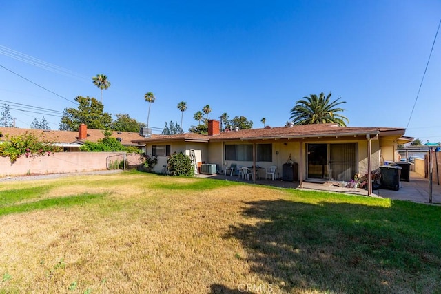 17480 Fontlee Ln, Fontana, CA 92335 - back of property with a chimney, a patio area, and stucco siding