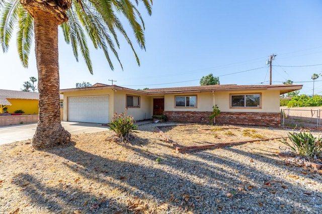 17480 Fontlee Ln, Fontana, CA 92335 - ranch-style home featuring brick siding, concrete driveway, stucco siding, and a garage