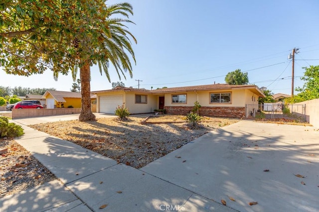 17480 Fontlee Ln, Fontana, CA 92335 - ranch-style house featuring an attached garage, stucco siding, brick siding, and driveway