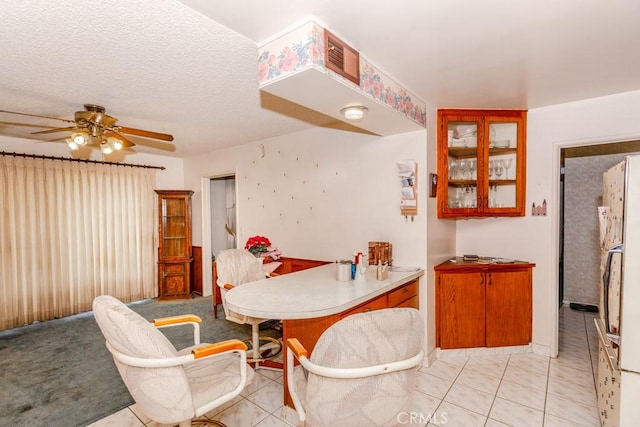 17480 Fontlee Ln, Fontana, CA 92335 - dining room with a ceiling fan, light tile patterned flooring, and a textured ceiling