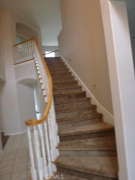 23261 Castle Rock, Mission Viejo, CA 92692 - stairway featuring baseboards and tile patterned flooring