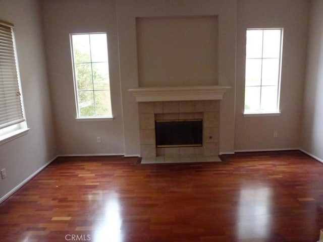 23261 Castle Rock, Mission Viejo, CA 92692 - unfurnished living room with wood finished floors and a tile fireplace