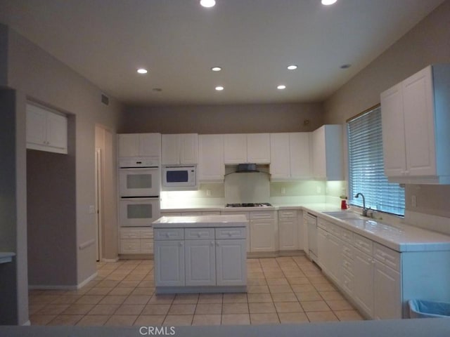 23261 Castle Rock, Mission Viejo, CA 92692 - kitchen featuring white appliances, white cabinetry, light countertops, recessed lighting, and light tile patterned floors