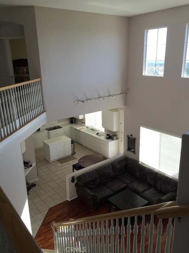 23261 Castle Rock, Mission Viejo, CA 92692 - living room featuring light tile patterned floors and rail lighting