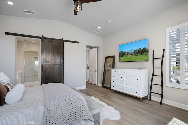 2526 N La Colina Ct, Orange, CA 92867 - bedroom with wood finished floors, lofted ceiling, a barn door, recessed lighting, and ensuite bathroom