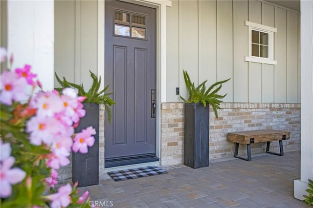 2526 N La Colina Ct, Orange, CA 92867 - view of exterior entry featuring board and batten siding and covered porch