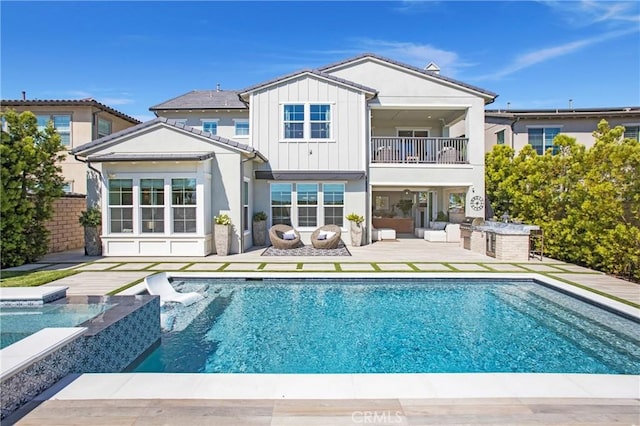 2526 N La Colina Ct, Orange, CA 92867 - rear view of property with a balcony, area for grilling, a patio, and an outdoor pool