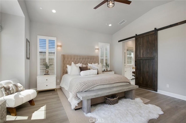 2526 N La Colina Ct, Orange, CA 92867 - bedroom with a barn door, vaulted ceiling, wood finished floors, recessed lighting, and a ceiling fan
