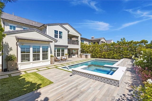 2526 N La Colina Ct, Orange, CA 92867 - rear view of property featuring a balcony, outdoor lounge area, a patio area, and a pool with connected hot tub