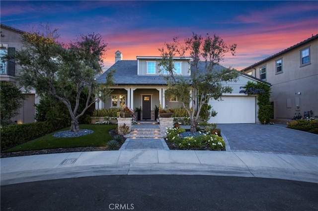 2526 N La Colina Ct, Orange, CA 92867 - view of front of home featuring driveway, an attached garage, covered porch, a yard, and a chimney