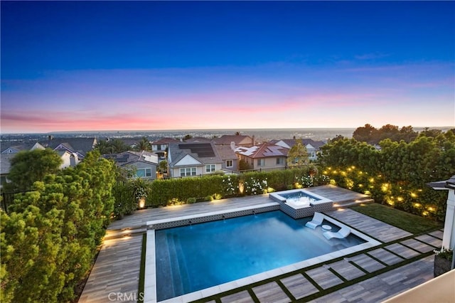 2526 N La Colina Ct, Orange, CA 92867 - pool at dusk featuring an in-ground hot tub, a residential view, and an outdoor pool
