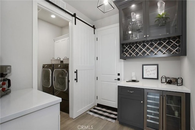 2526 N La Colina Ct, Orange, CA 92867 - indoor dry bar with washing machine and dryer, beverage cooler, a barn door, and light wood finished floors