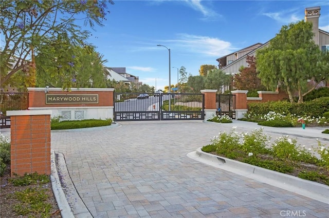 2526 N La Colina Ct, Orange, CA 92867 - view of road featuring a gate, curbs, street lighting, and a gated entry