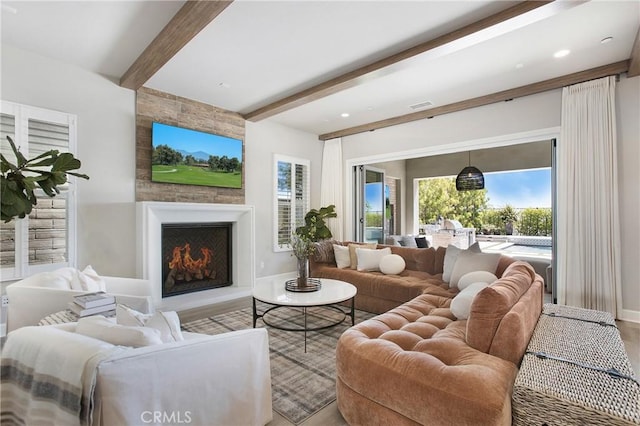 2526 N La Colina Ct, Orange, CA 92867 - living room featuring beamed ceiling, a fireplace, plenty of natural light, and wood finished floors