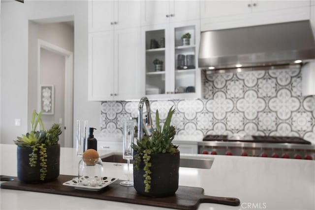 2526 N La Colina Ct, Orange, CA 92867 - kitchen with range hood, white cabinetry, tasteful backsplash, glass insert cabinets, and dark countertops