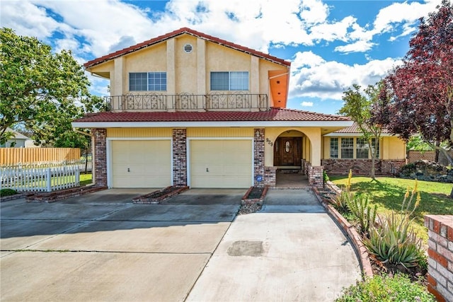 929 9th St, Williams, CA 95987 - mediterranean / spanish-style house featuring stucco siding, driveway, a garage, and a tiled roof