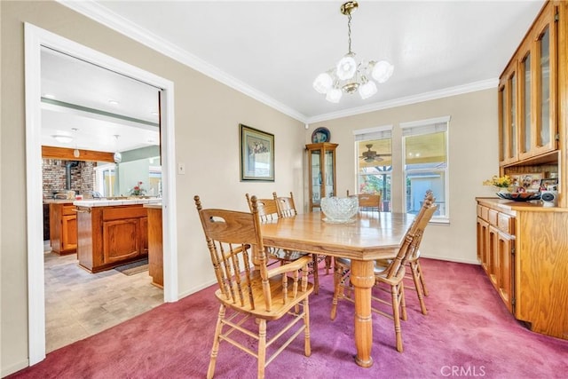 929 9th St, Williams, CA 95987 - dining space with light colored carpet, a chandelier, and crown molding