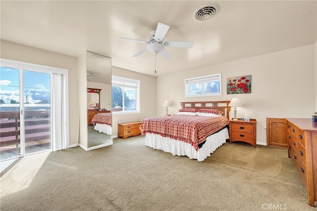 929 9th St, Williams, CA 95987 - bedroom featuring light colored carpet, access to exterior, and a ceiling fan