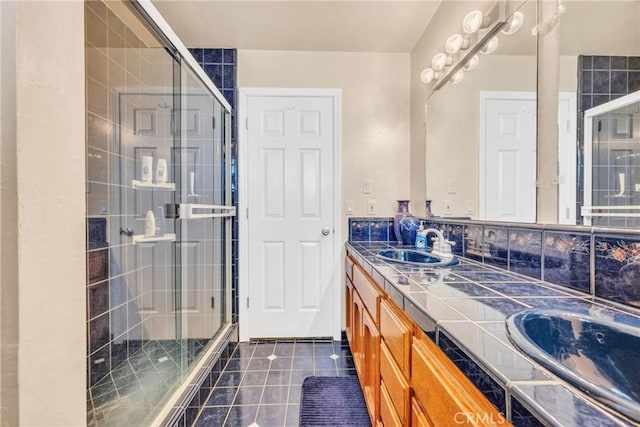 929 9th St, Williams, CA 95987 - bathroom featuring double vanity, tile patterned floors, and a stall shower