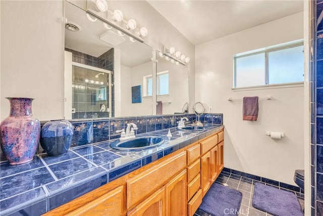 929 9th St, Williams, CA 95987 - bathroom with double vanity, a shower stall, and tile patterned floors