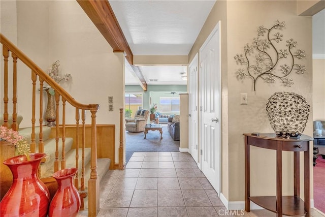 929 9th St, Williams, CA 95987 - carpeted entryway with stairs, tile patterned flooring, and beam ceiling