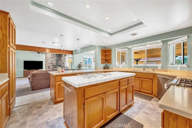 929 9th St, Williams, CA 95987 - kitchen with white gas cooktop, a tray ceiling, open floor plan, dishwasher, and a peninsula