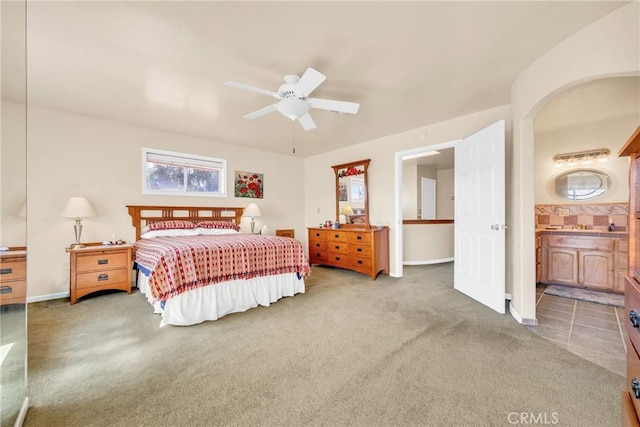 929 9th St, Williams, CA 95987 - carpeted bedroom with ensuite bathroom, ceiling fan, and arched walkways