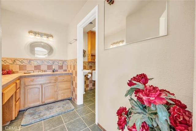 929 9th St, Williams, CA 95987 - bathroom featuring tile patterned floors, tile walls, and a wainscoted wall