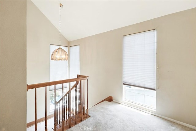 524 St Kevin Ct, Merced, CA 95348 - hall with a chandelier, carpet flooring, an upstairs landing, plenty of natural light, and high vaulted ceiling