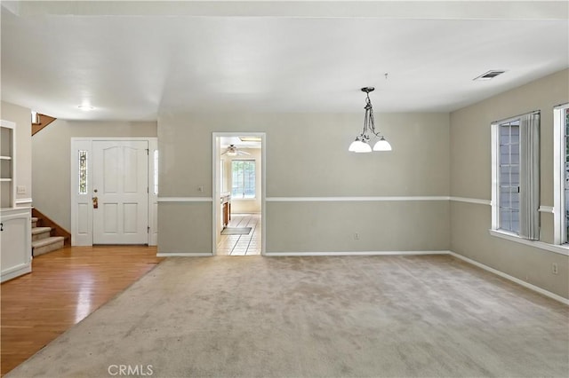 524 St Kevin Ct, Merced, CA 95348 - unfurnished room with stairs, carpet floors, and ceiling fan