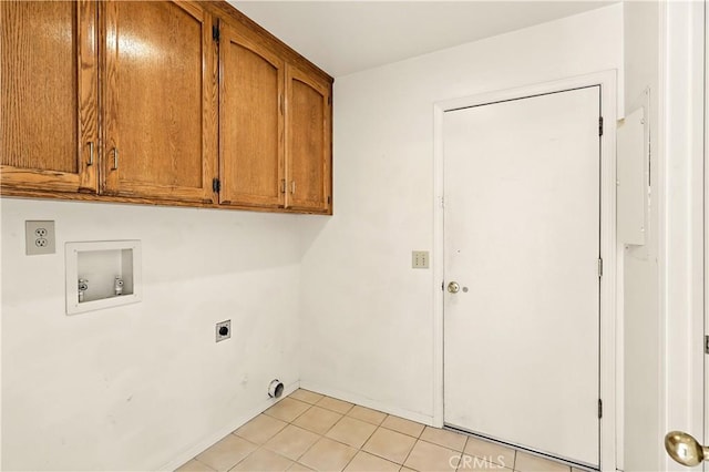 524 St Kevin Ct, Merced, CA 95348 - laundry area with cabinet space, electric dryer hookup, hookup for a washing machine, and light tile patterned flooring