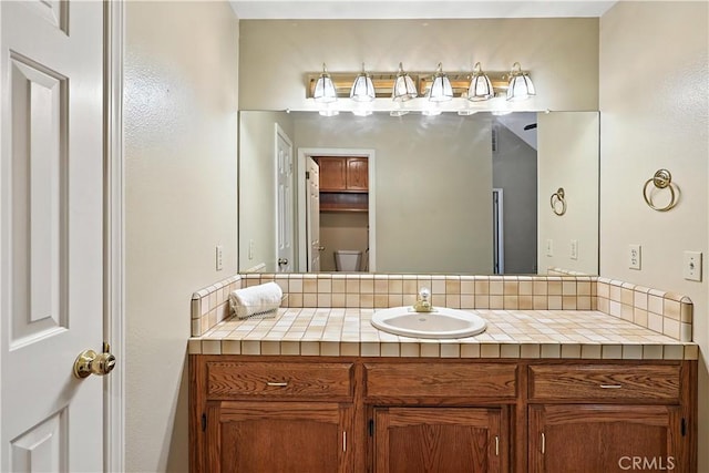 524 St Kevin Ct, Merced, CA 95348 - bathroom featuring vanity and tasteful backsplash