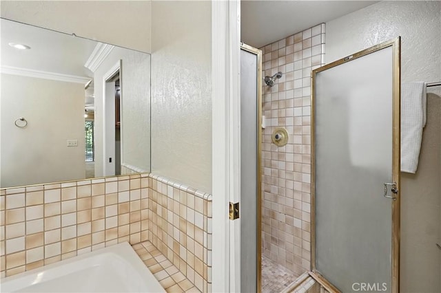 524 St Kevin Ct, Merced, CA 95348 - bathroom with a stall shower, crown molding, and a bath