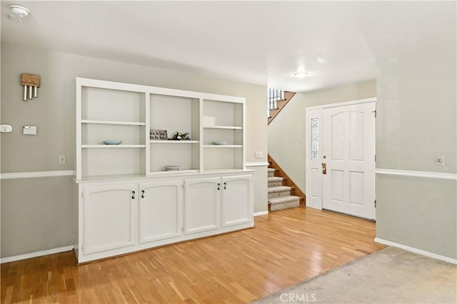 524 St Kevin Ct, Merced, CA 95348 - unfurnished dining area featuring stairway and light wood-style flooring