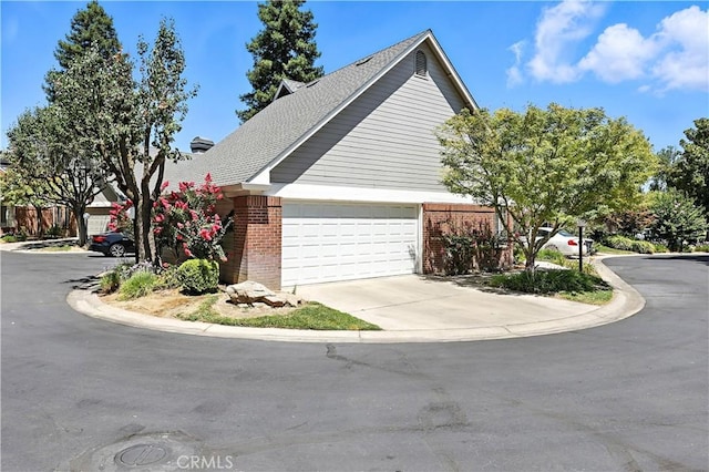524 St Kevin Ct, Merced, CA 95348 - view of front of home featuring brick siding and driveway