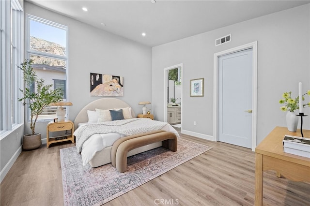 620 Baldwin Ct, Sierra Madre, CA 91024 - bedroom with multiple windows, wood finished floors, recessed lighting, and ensuite bath