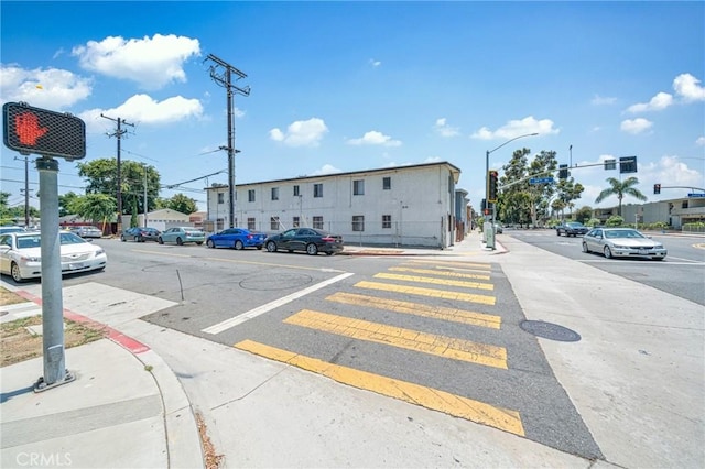 3390 Santa Fe Ave, Long Beach, CA 90810 - view of asphalt road featuring sidewalks, street lights, and curbs