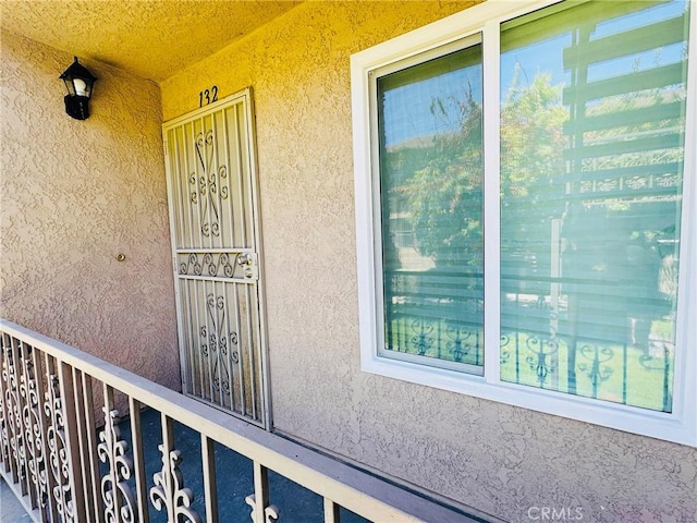 5484 Dobbs St Unit 132, Los Angeles, CA 90032 - doorway to property with stucco siding