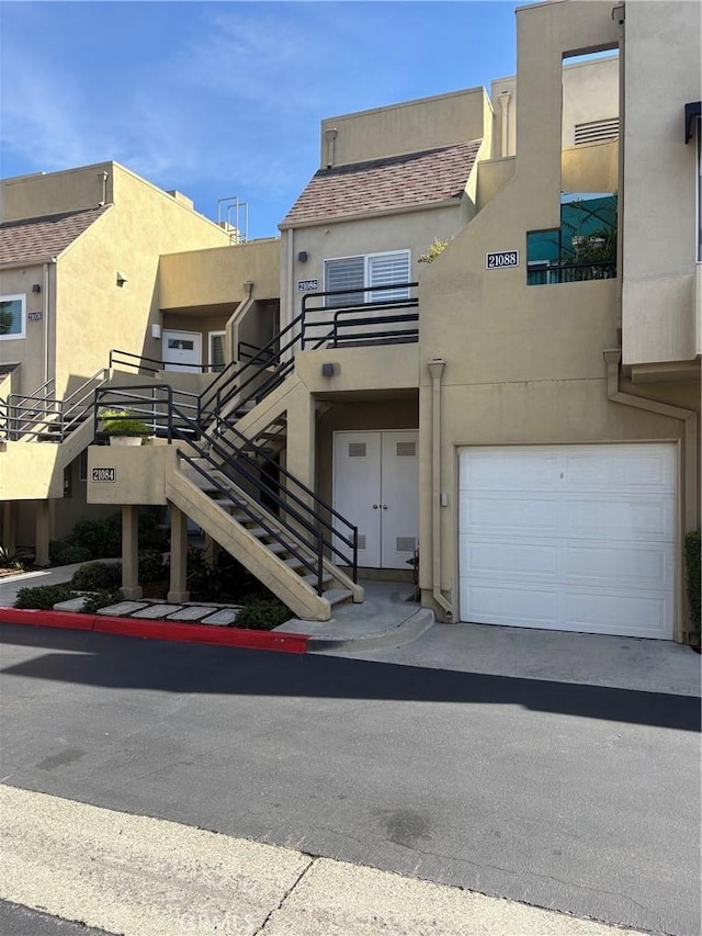 21086 Mauve Unit 79, Mission Viejo, CA 92691 - view of property featuring an attached garage