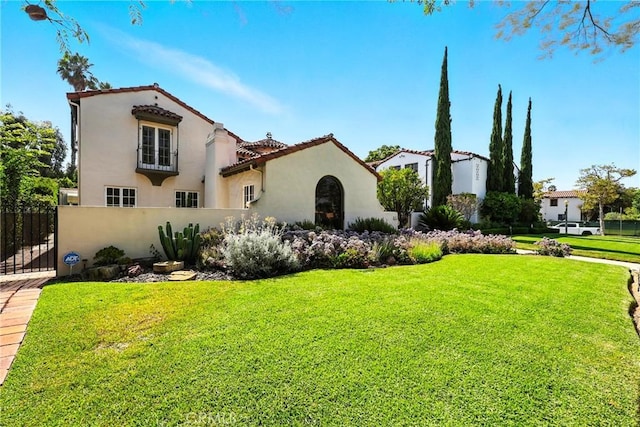 408 N Mccadden Pl, Los Angeles, CA 90004 - mediterranean / spanish home with stucco siding, a gate, and a tile roof