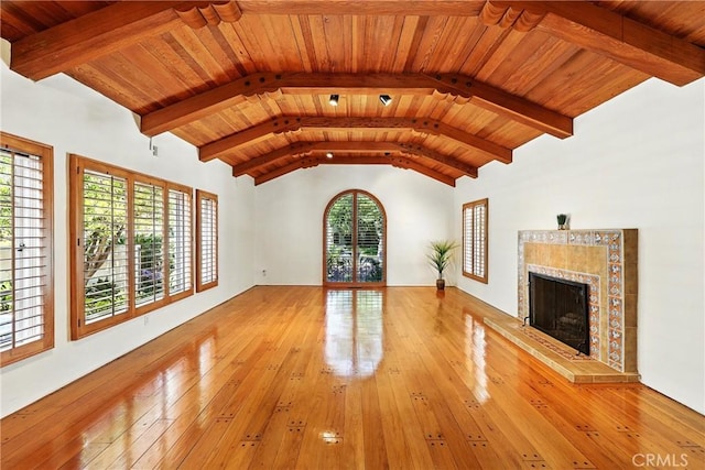 408 N Mccadden Pl, Los Angeles, CA 90004 - unfurnished living room featuring a tiled fireplace, hardwood / wood-style flooring, and wooden ceiling