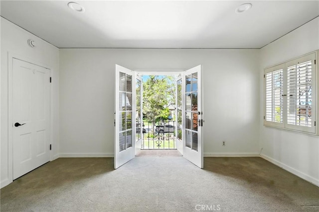 408 N Mccadden Pl, Los Angeles, CA 90004 - carpeted spare room featuring french doors and baseboards