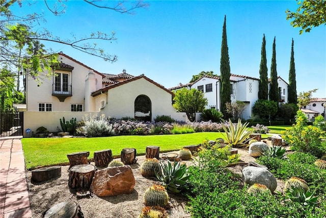 408 N Mccadden Pl, Los Angeles, CA 90004 - mediterranean / spanish-style house featuring stucco siding, a front lawn, and a tiled roof