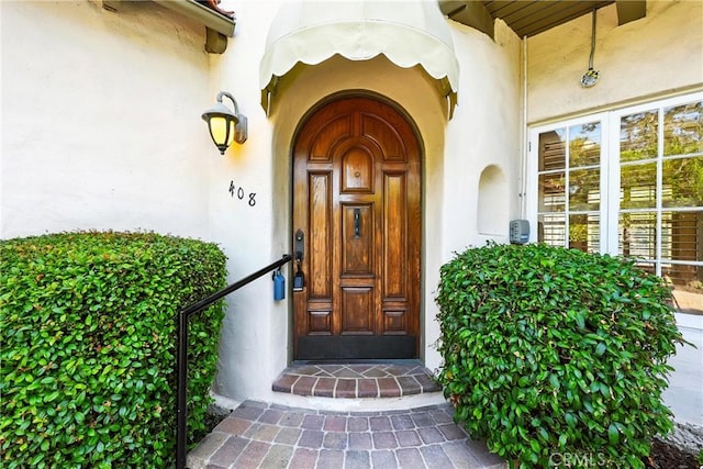 408 N Mccadden Pl, Los Angeles, CA 90004 - doorway to property featuring stucco siding