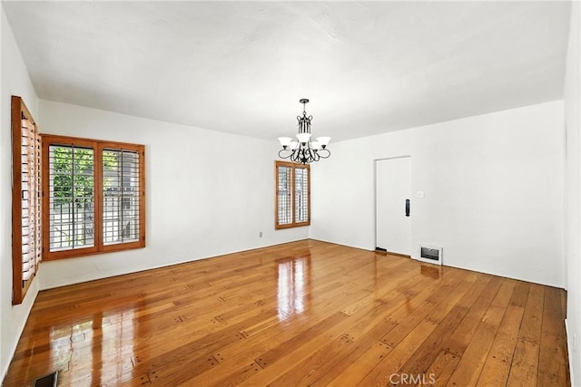408 N Mccadden Pl, Los Angeles, CA 90004 - unfurnished dining area with a chandelier and hardwood / wood-style flooring