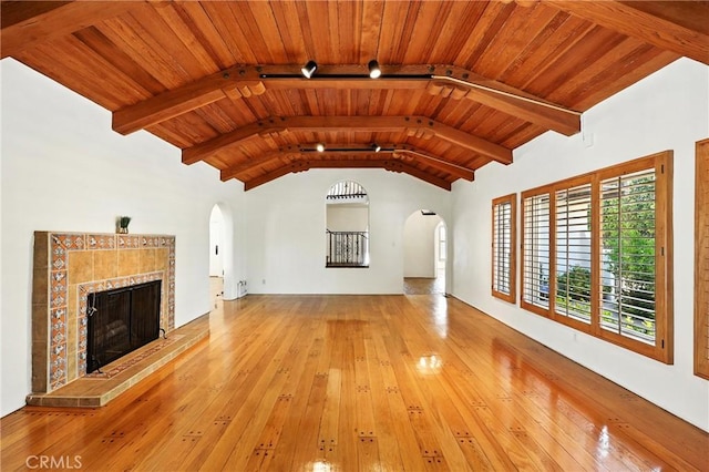 408 N Mccadden Pl, Los Angeles, CA 90004 - unfurnished living room with arched walkways, hardwood / wood-style floors, wood ceiling, and a fireplace